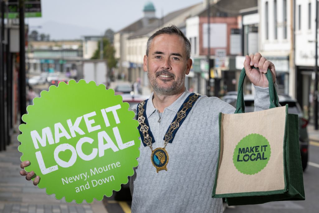 Chairperson Cllr Philip Campbell promotes the Make It Local campaign on Downpatrick High Street