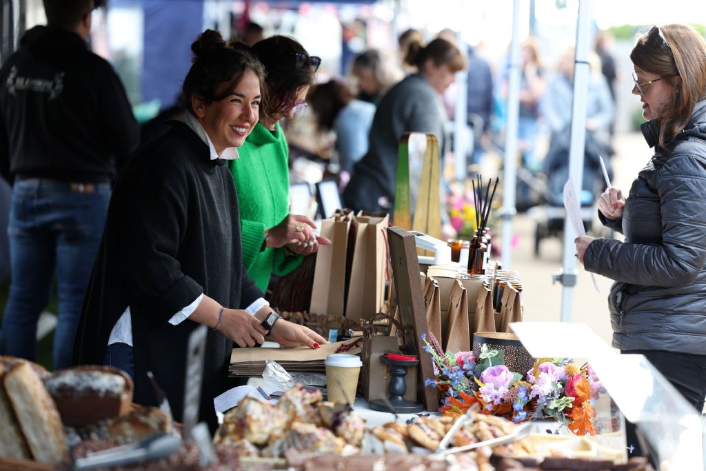 Artisan market trader serving customers