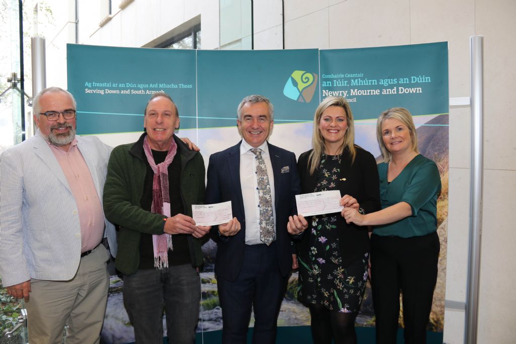 photo 1 former council chairman mark murnin presents cheques to nominated charities from charity walk challenge.JPG