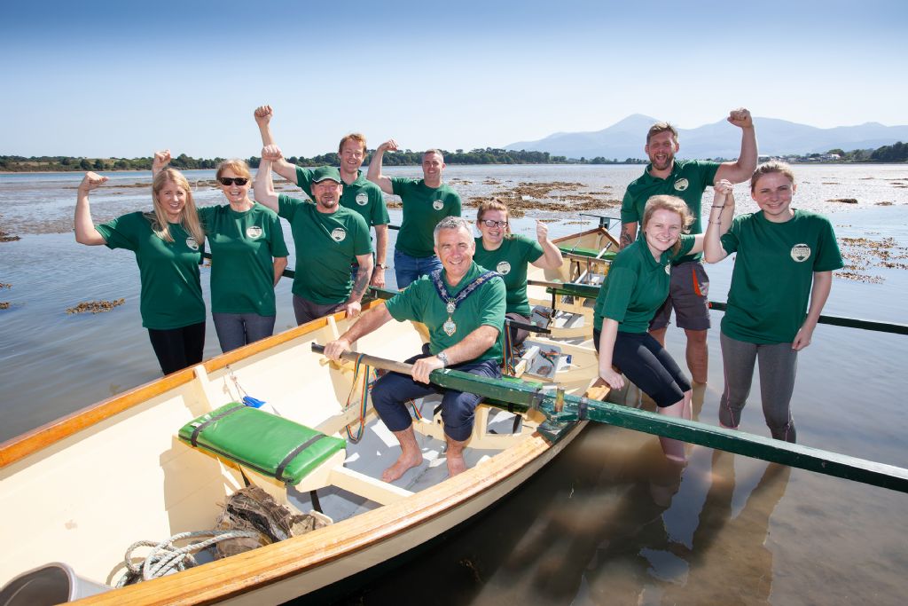 pic 2 - members of the dundrum coastal rowing club with newry mourne and down district council chair councillor mark murni